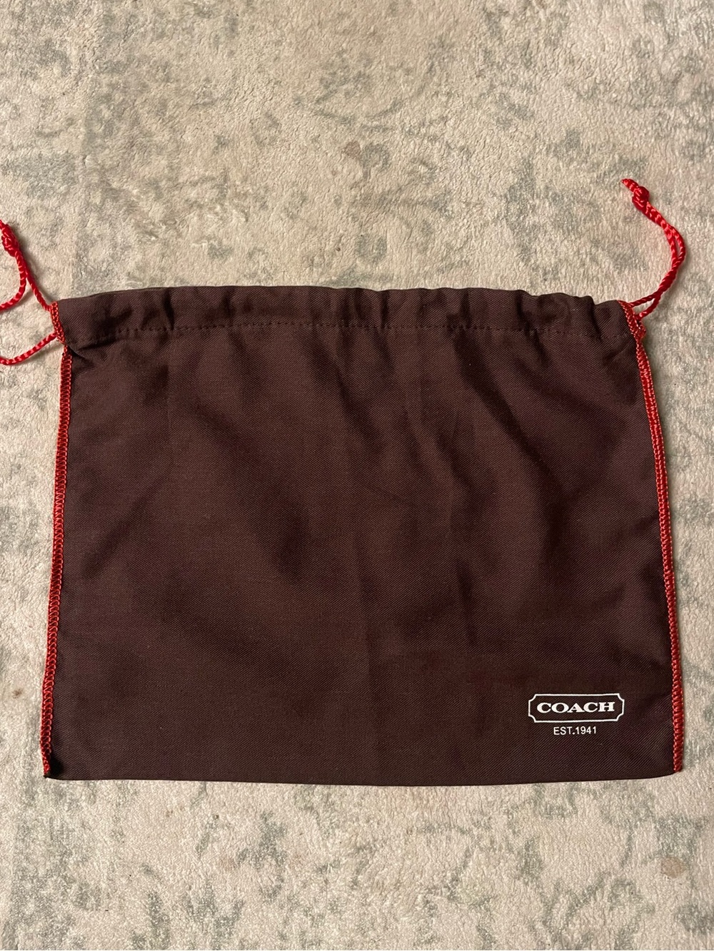 18. Small coach dust bag.